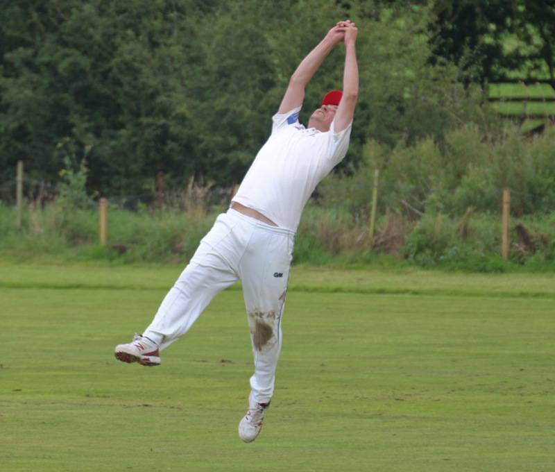 a full-length catch off his feet in the air by a cricketer