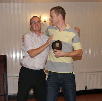 mark boyns and alex miller at sefton park cricket club collecting an award
