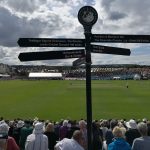 scarborough cricket club pitch view from the entrance with the famous black signpost